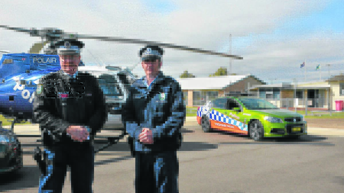 OPERATION SILVERSTONE: Chief Inspector Trent Le-Merton Northern Region traffic tactician for the Traffic & Highway Patrol Command, and Hunter Valley Local Highway Patrol Senior supervisor, senior sergeant Tony Grace at Rutherford Airport on Wednesday.