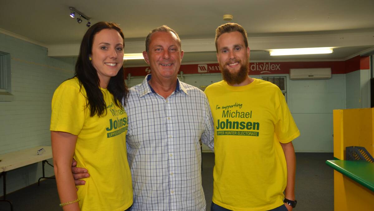 Lucy Johnsen with her father Michael Johnsen and Callum Maclean await the final count for the seat of Upper Hunter.