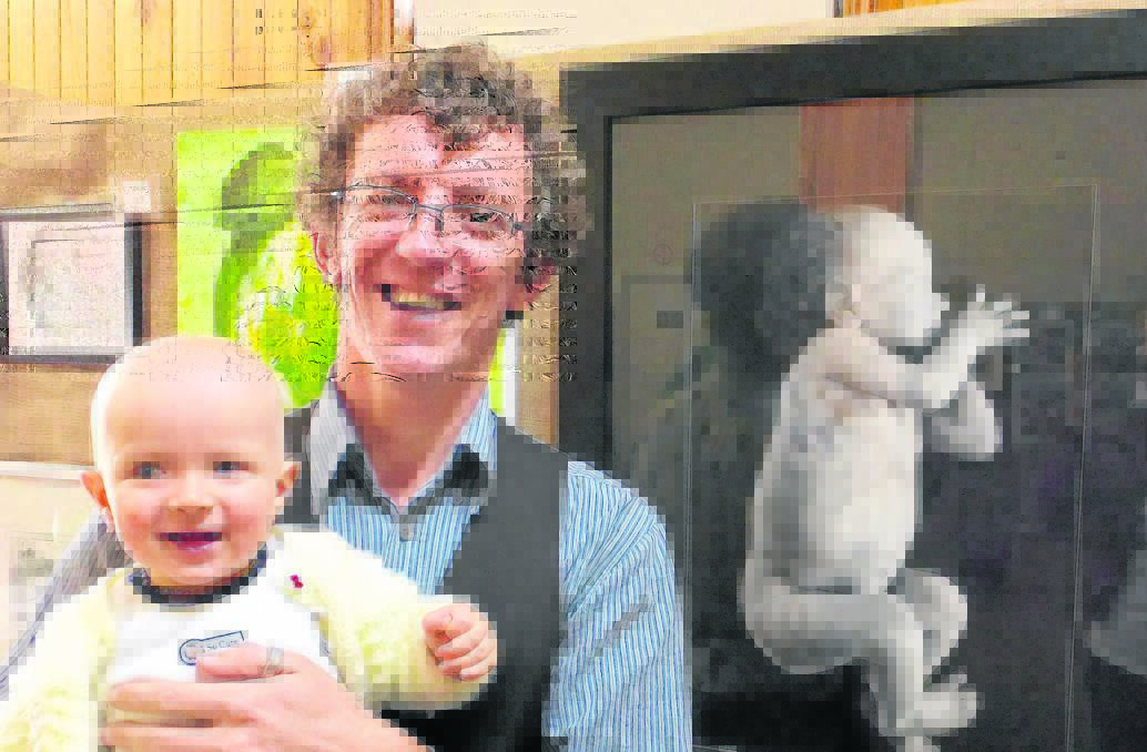 PICTURE PERFECT: Art in the Vines winner Mitchell O’Mahoney with baby boy Joquen, who provided the artist’s inspiration.

