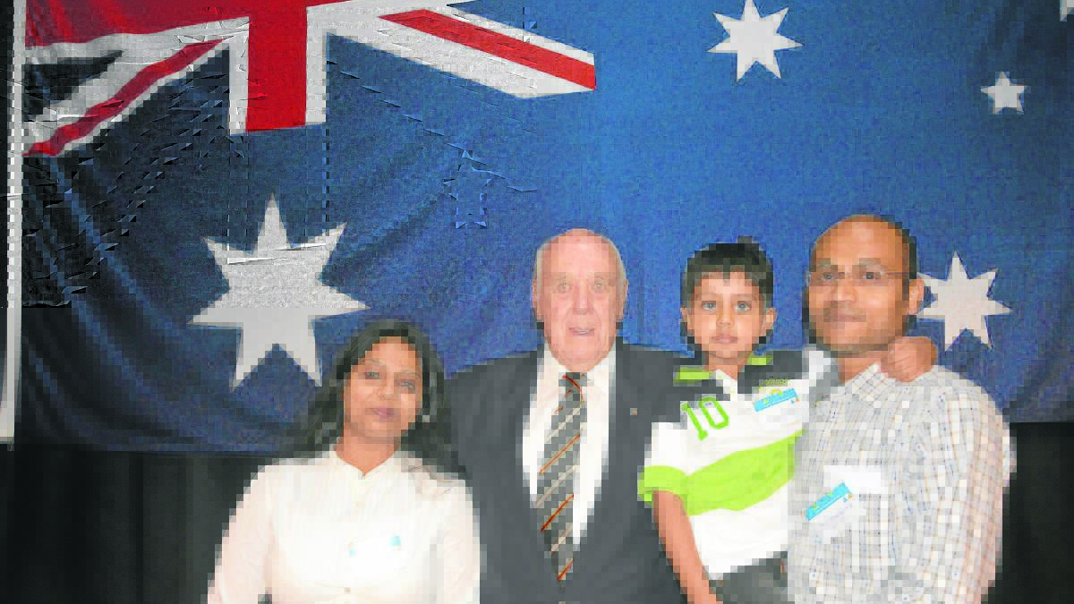 PROUD CITIZENS: Dharmesh and Bhumika Patel, with son Rudra and Singleton mayor John Martin.