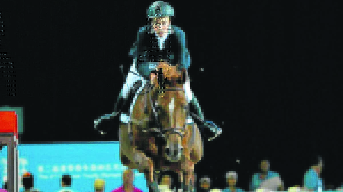 EQUESTRIAN EVENT:  Jake Hunter competes in the Youth Olympics in China. 	photo: olympics.com.au