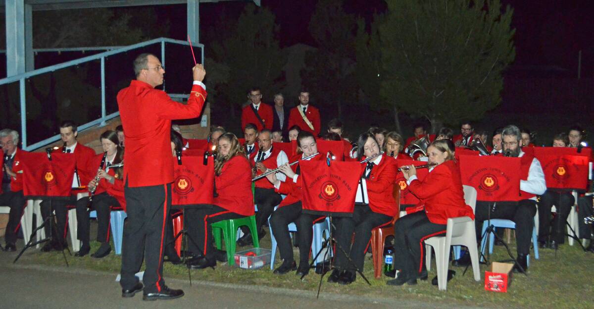 Singleton Anzac Day dawn service  Peter Knight conducts the town band.