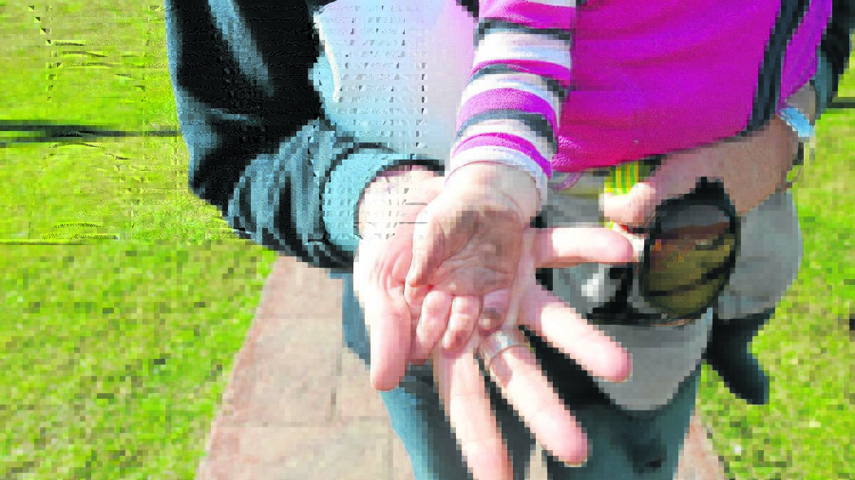 NOT A GOOD LOOK: Maycae’s hand covered in coal dust after a crawl on the verandah. 