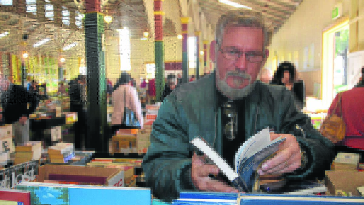 GREAT FIND: Michael Mendyk from Branxton browses the books at the Singleton Showground on Thursday. 