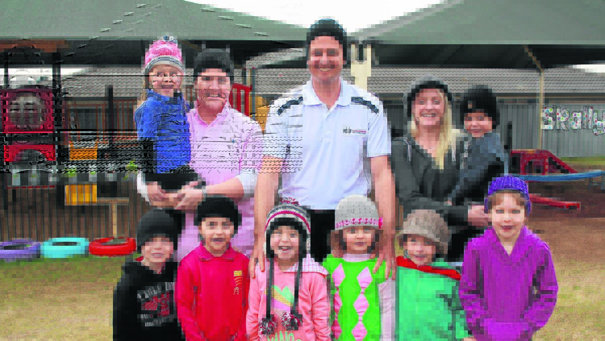 GREAT CAUSE:  When Mark Hughes found out about Skallywags pre-school getting behind his foundation’s inagural ‘Wear Your Beanie for Cancer Awareness Day’ he was more than willing to visit the children.
(L-r) Back  Ellie Bailey, Steph Moore, Mark Huges, Tara Scott and Hunter Knott.
Front Nat Vesper, Georgine Gersbach, Tamah Holz, Sybella Muddiman, Oscar Crosby and  Pippa Crosby.