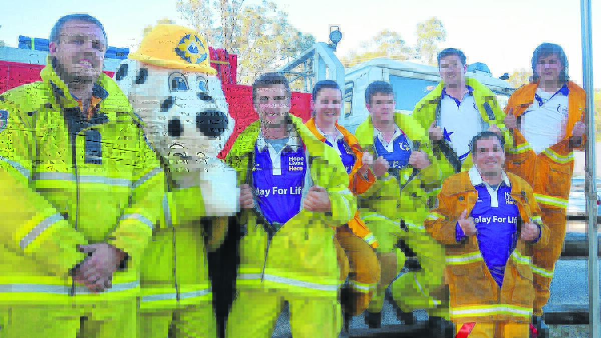 FIREFIGHTERS FIGHT CANCER: Members of the Darlington Fire Brigade, who will walk in this weekend’s Singleton Relay for Life, from left, Kirk Badior, Aaron Stuart as Fluffy the Dog, Hayden Metcalf, Liz Algie, Jordan Enright, Rory Firkins, Shawn Wolfe and John Algie. 
