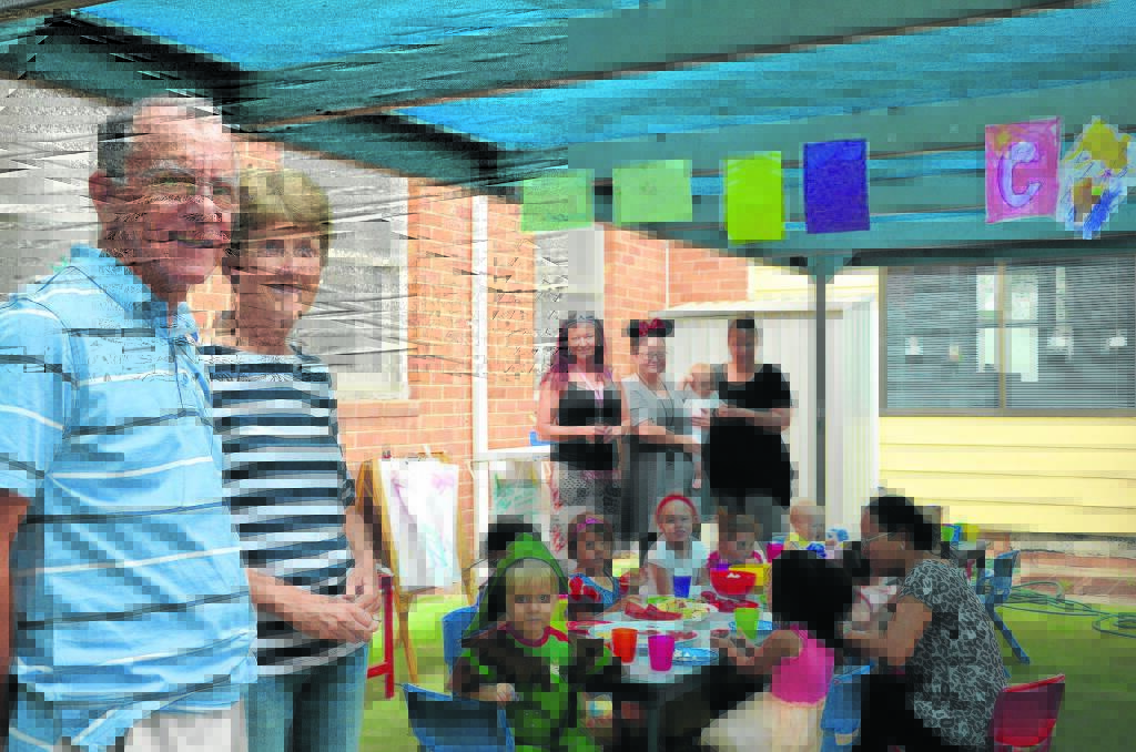 COMMUNITY-MINDED: Mailrun Charity Bike Ride organisers Ken and Debbie Dreaper pay a visit to the Singleton Family Support’s weekly playgroup session.