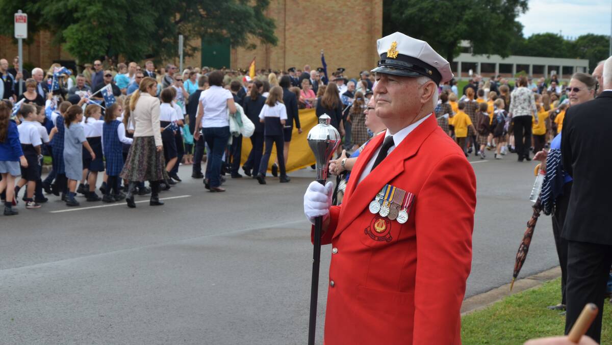 David Walker leads the town band during the Anzac march.  