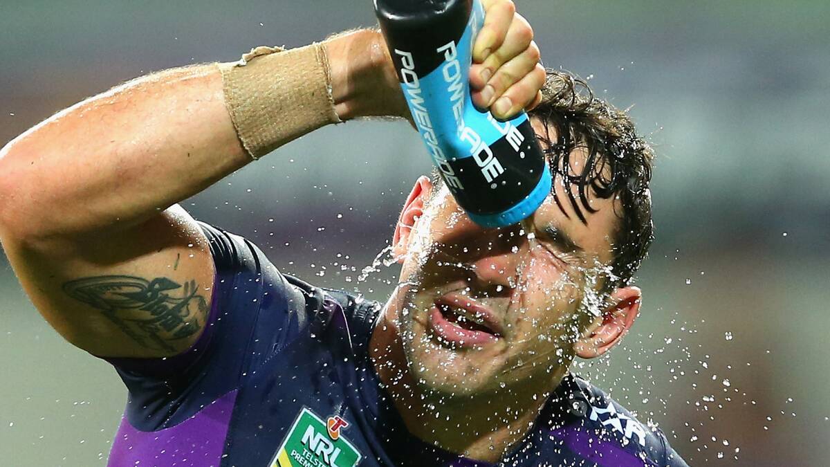 Billy Slater of the Storm sprays himself with water during the round one NRL match between the Melbourne Storm and the St George Illawarra Dragons at AAMI Park on March 7, 2016 in Melbourne, Australia. Pic: Quinn Rooney/Getty Images