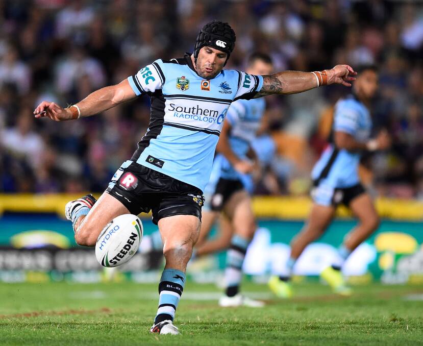  Michael Ennis of the Sharks kicks the ball during the round one NRL match between the North Queensland Cowboys and the Cronulla Sharks at 1300SMILES Stadium on March 5, 2016 in Townsville, Australia. Pic: Ian Hitchcock/Getty Images