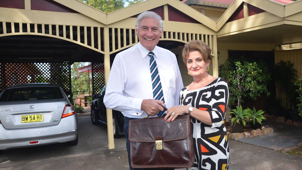 LAST DAY AT THE OFFICE: Upper Hunter MP George Souris is farewelled by his wife Vassy, with less than 24 hours remaining in his job.