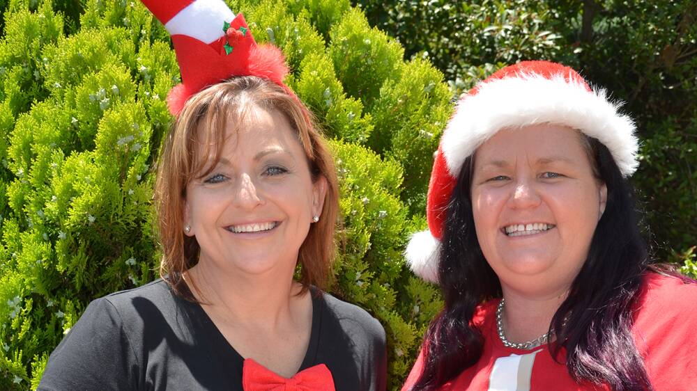 FESTIVE SUPPORT: Debbie Kneipp and Carmen Lee-Williams are volunteers at the Samaritans Christmas Lunch, which celebrates its 10th anniversary in 2015.