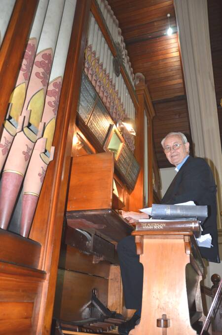 TICKLING THE IVORIES: Reverend John E Webster, in front of the historic pipe organ, is inviting residents to celebrate Heritage Week at the Singleton Uniting Church