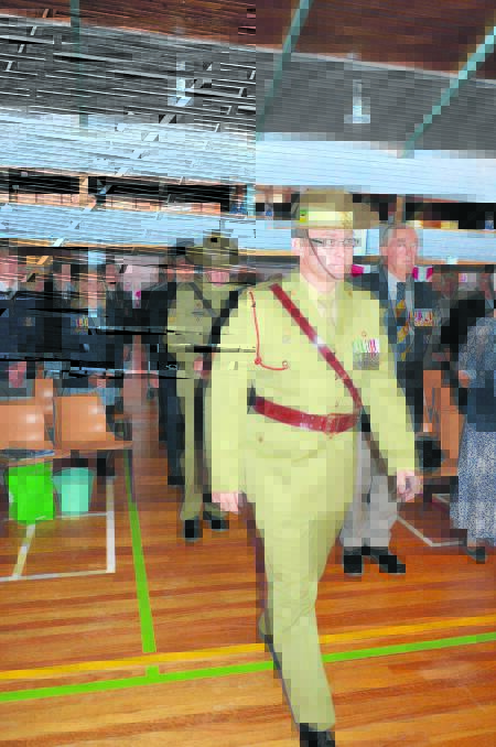 ABOVE: Lt Col Marcus Constable leading the official party onto the stage at the beginning of the Anzac Day ceremony.
