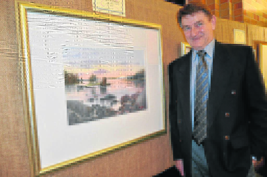 Terry Benson with one of his stunning watercolours.