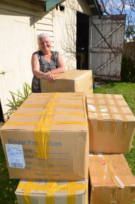 Colleen Blofield with the nine boxes.