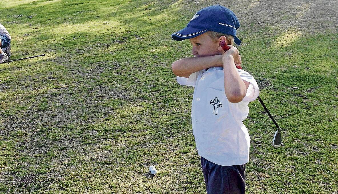 STARTING YOUNG:  A young star in the making, Thomas Pearce, shows his stylish swing during the regular Tuesday junior golf coaching.