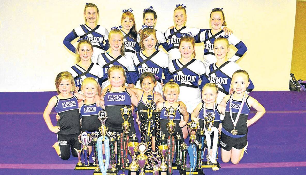 CHEER FOR CHAMPS:   Members of Fusion Cheerleading who have enjoyed strong results throughout 2013 (back l-r) Grace Nichols, Reece Robinson, Brooke Merrick, Georgia Dalley, Maddie Wood, (middle) Issy Lewis, Lucy Macfarlane, Trinity Robinson, Amadee Smith, Ashley Sherriff, (front) Madison Parnell, Angel Smart, Maycee Smart, Amelia Slomka, Sierra Merrick, Isabella Osborn and Sienna Osborne.