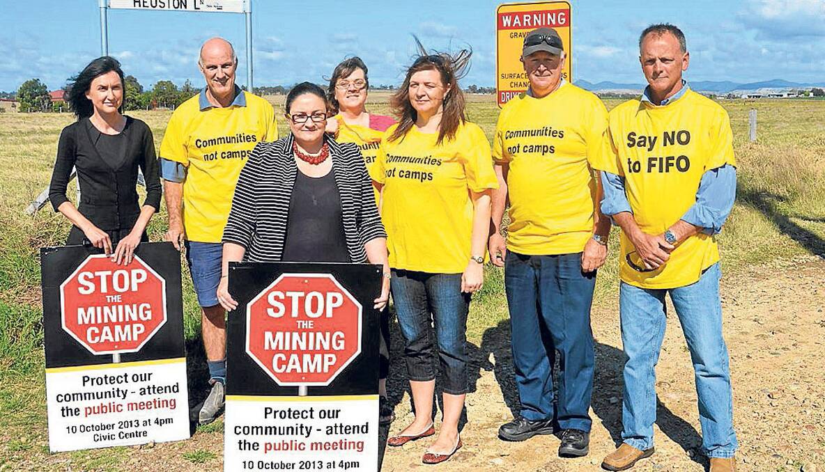 NO TO CAMP: Members of the Better Future for Singleton Shire Association Tara Hungerford, Andrew Shaddock, Renae Kelly, Sarah Johnstone, Rebecca Williams, Robert Ball and Mark Ryan near the site of the proposed temporary accommodation village at Glenridding.