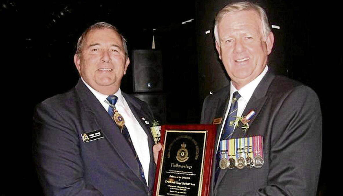 DESERVING:  The award was made to Neill Bell (right)  at the Anzac day re-union and Annual Meeting of the NSW Branch by former Chief of Navy Vice-Admiral Russ Crane AO, CSM, RAN (retired). 
