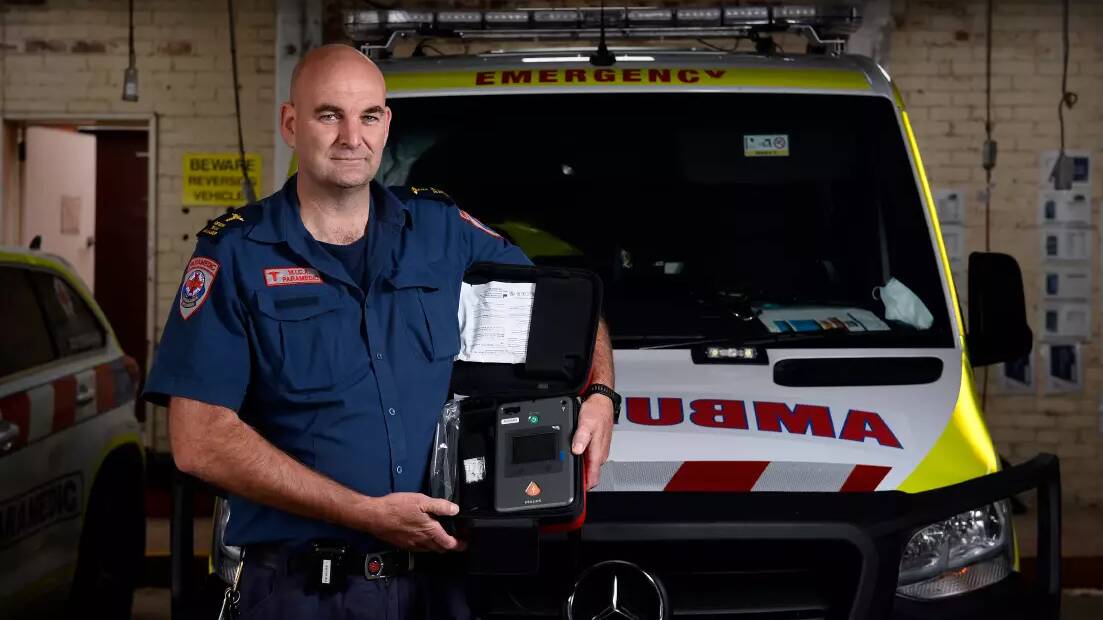 MICA paramedic Mark Brown with a defibrillator used to restart the heart in cases of cardiac arrest. Picture: Adam Trafford