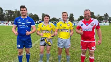 RESPECT: The captains of the Greta Branxton Colts (left) and Singleton Greyhounds (right) pose with the referees prior to their Group 21 game on Sunday, May 15. 