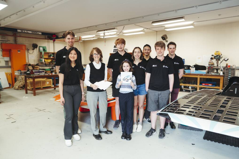 Australia's chief scientist Dr Cathy Foley and nine-year-old Evelyn Fox with ANU solar racing team members Isaac Martin, Nicole Wang, David Wilson, Madeleine Pont, Edwin Schuler, Joseph Fergusson and Robin Hodda. Picture: Dion Georgopoulos 