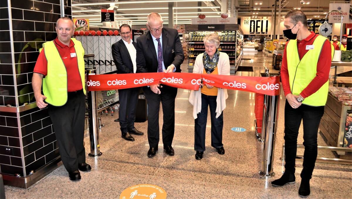 OPEN: Coles Huntlee store manager Tim Hill, Huntlee project director Stephen Thompson, Cessnock mayor Bob Pynsent, Greta resident Val Randall and Coles NSW North general manager Ivan Slunjski at the store opening on Wednesday morning. Picture: Krystal Sellars