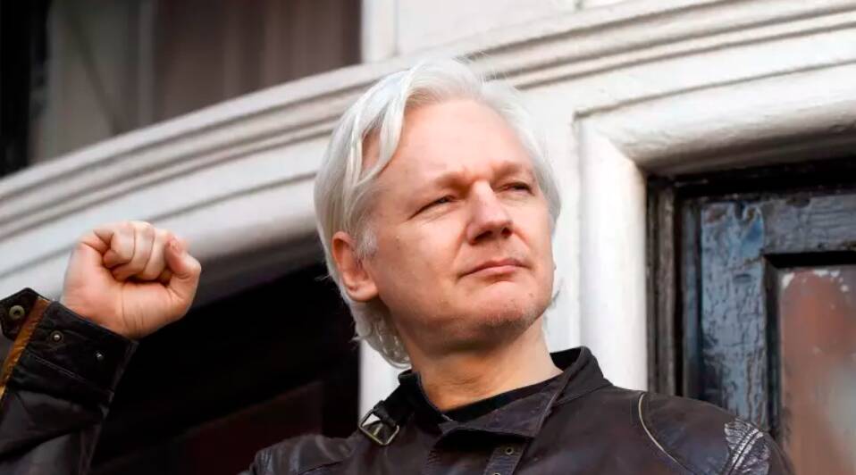 Julian Assange greets supporters outside the Ecuadorian embassy in London in 2017. He has attracted public support from which former Playboy playmate? 