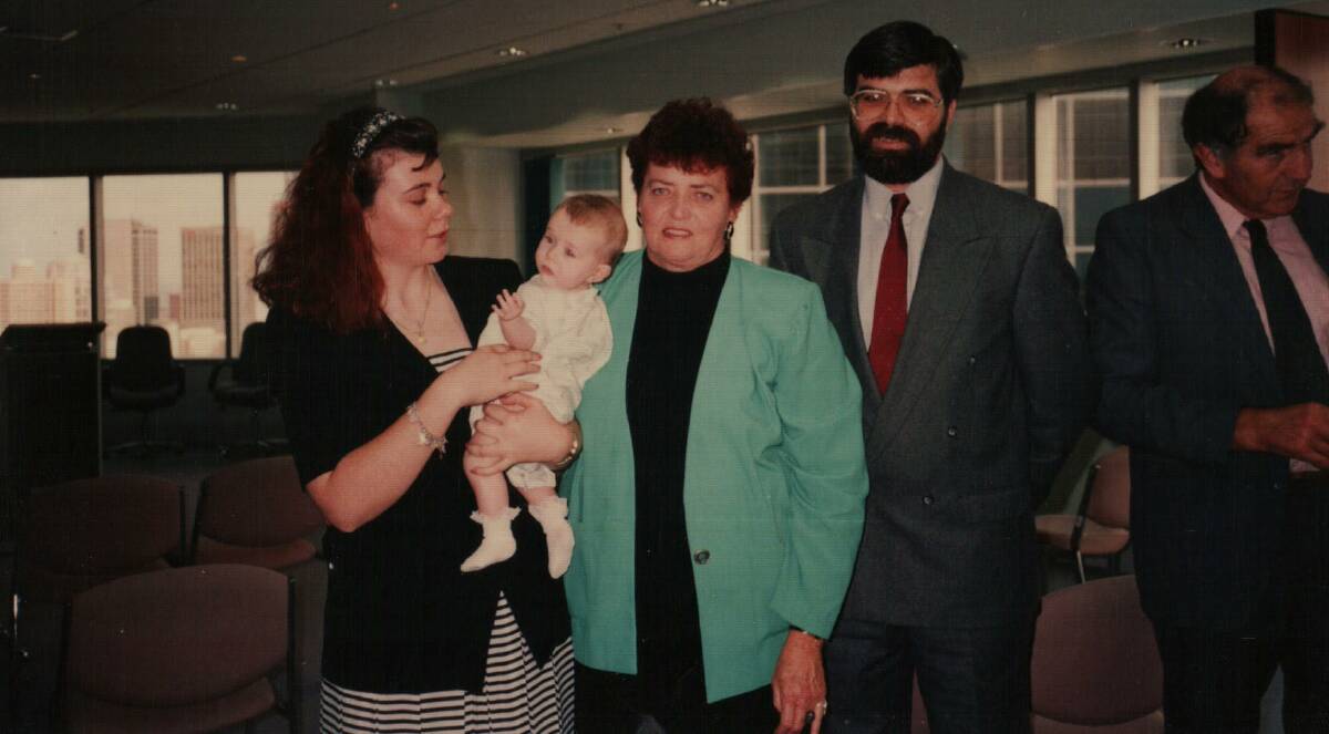 Photo taken in Senator Kim Carr's office in the 1990s with Kim and his mother Maxine James and her daughter Jenelle James with baby Ruth, Kim's daughter.