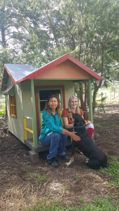  Julie Bush and her friend Chloe Hebbe with the recently arrived cubby house. Photo supplied. 