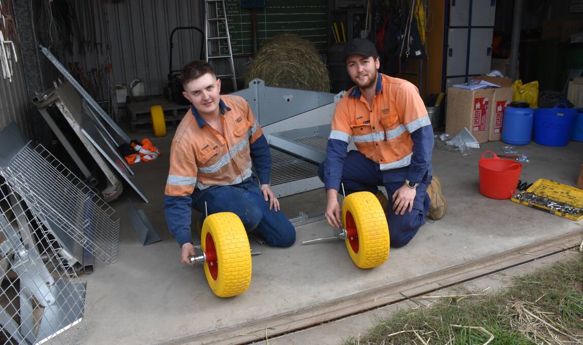 Conaugh Stewart and Jordan Clay part of the Mt Owen Glendell Operations team helping to assembly the new chicken caravan at St Catherine's Catholic College.