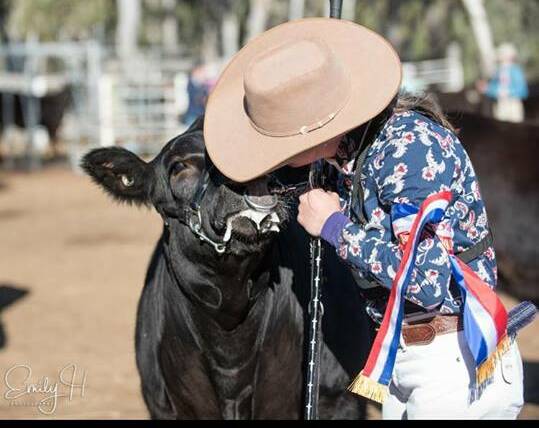 WINNERS: Caitlin Porter, Merriwa wins the junior champion paraders ribbon at the recent National Limousin Junior Show. Photograph supplied Emily H Photography