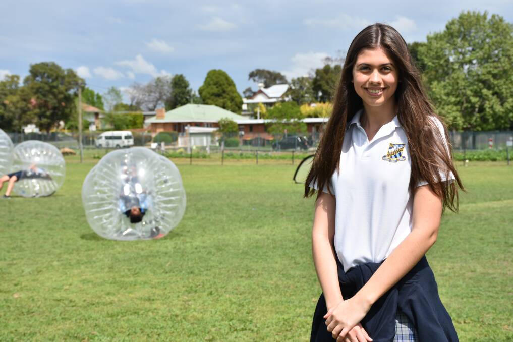 AWARENESS: Charlotte Smith-Hughes 2019 Singleton High School girls captain with some of the Year 8 students playing bubble soccer.