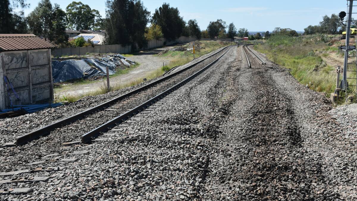 END OF THE LINE: Rail line cut temporarily to enable placement of the new bridge across the NE Highway.