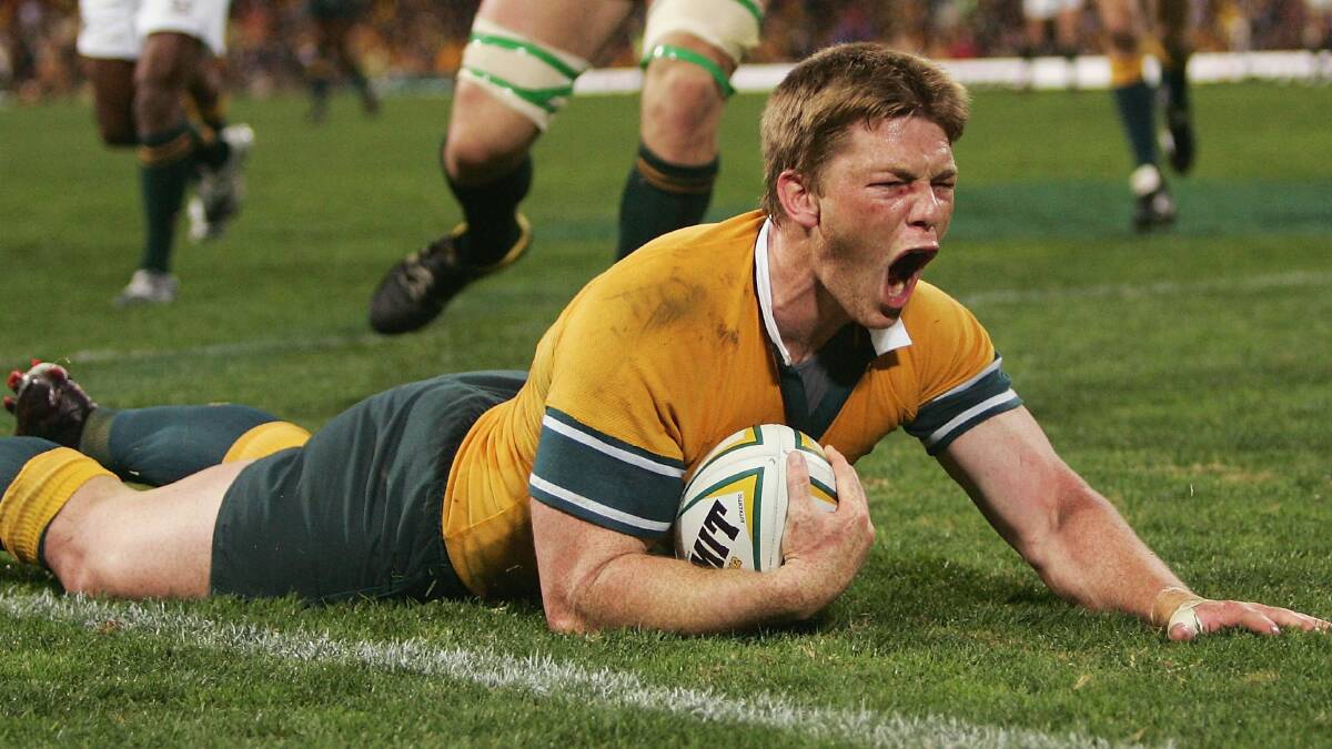  Clyde Rathbone of the Wallabies crosses and celebrates the winning try during the Tri Nations rugby union test between the Australian Wallabies and the South African Sprinboks at Subiaco Oval July 31, 2004 in Perth, Australia. (Photo by Nick Laham/Getty Images