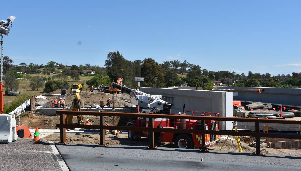 READY: The new railway bridge just about to be lifted into place on Tuesday morning - providing a wider access on the New England Highway just north of Singleton.