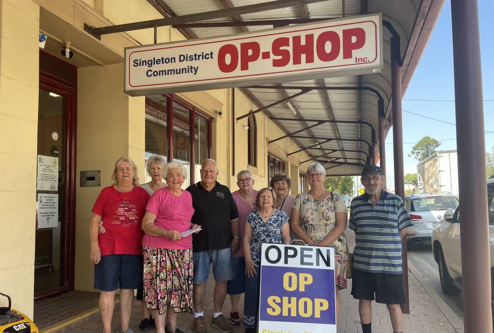 Singleton District Community Op Shop volunteers and committee members along with members of the Singleton Hospital Auxiliary for the hand-over of the cheque donations.