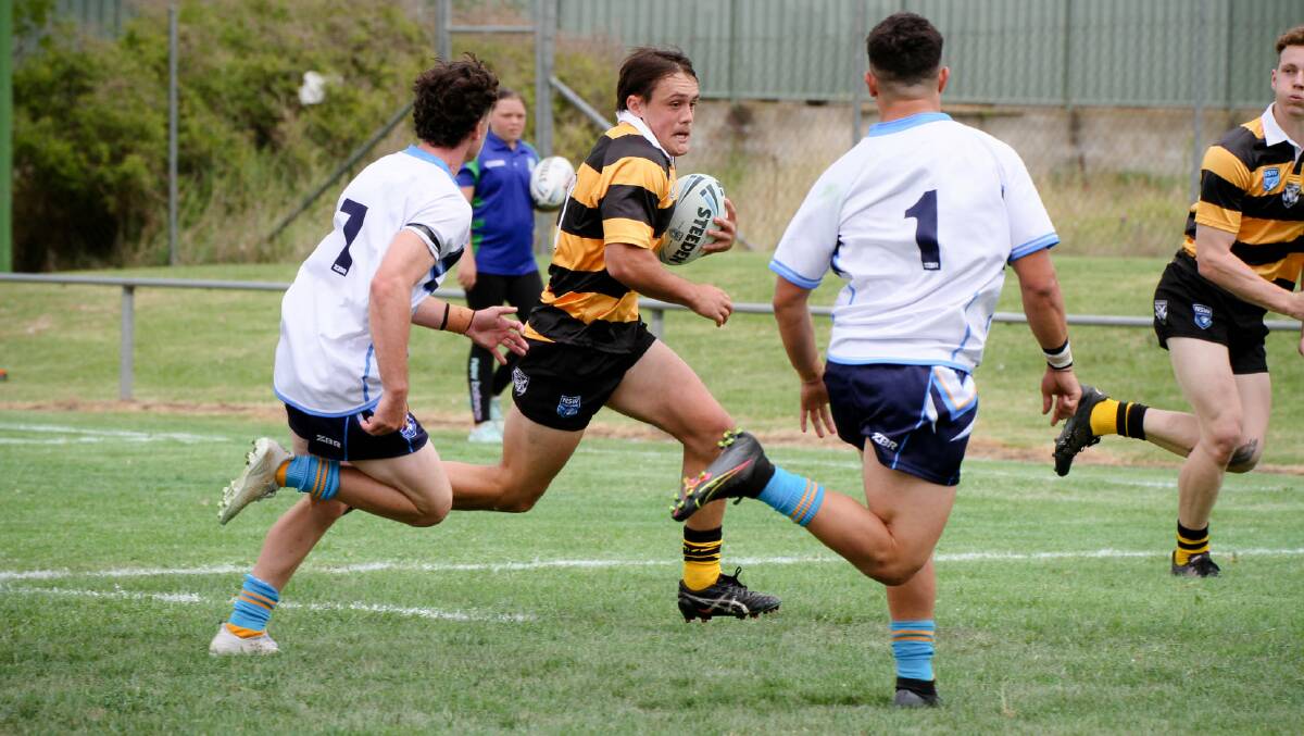Mitch Henderson in full flight for the Tigers against the Titans last Saturday. He scored two goals in their win over the Newcastle Maitland Knights at Cessnock.