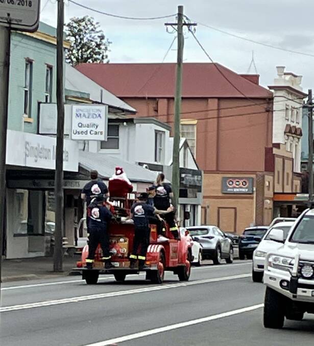 FIRIES: First day of the Fire and Rescue lolly run with Santa making an appearance on the old Bedford truck.