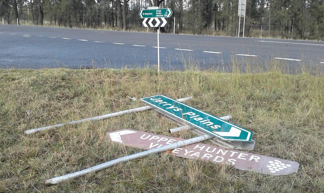 Singleton Council has already removed signs at the intersection of Wallaby Scrub and Putty roads - maybe a bit too early. Photo supplied.