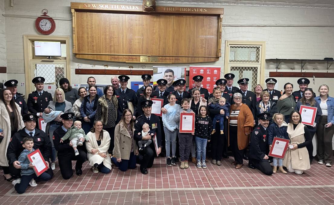 SUPPORT: Fire & Rescue members from Singleton and Branxton were joined by their families last week for a special commendation ceremony at 444 fire station. 