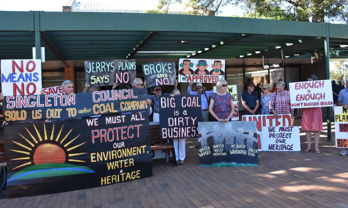OPPOSITION: Protesters gather outside the Independent Planning Commission meeting reviewing the Glencore/Peabody United Wambo Open Cut Coal Mine Project.