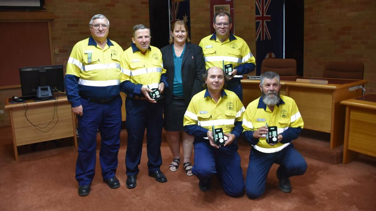 DEDICATION: Members of CREST NSW John King, Wayne Lawrence, Mayor Sue Moore, Greg Bruce (at front) Andrew Pain and Brian Hall. Photo 2018.
