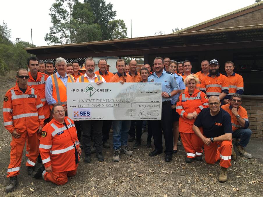 There are SES and mine workers with the $5,000 cheque (L-R) is John Richards, The Bloomfield Group Chairman, Brett Lewis, TBG CEO,  Luke Murray, Rix’s Creek Mine Manager and Simon Merrick, SES Singleton Local Controller.     