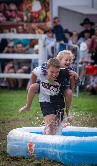 Siblings competing in the 'wife carrying competition.Nyomi Aubrey Photography