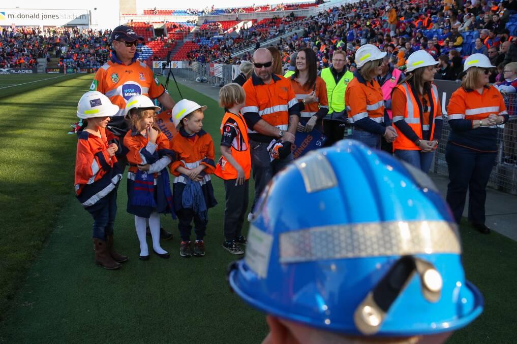 Newcastle Knights vs Wests Tigers at McDonald Jones Stadium in Newcastle. Pic shows kids in hi-vis clothing waiting for players to run out before the game. Picture: Max Mason-Hubers MMH