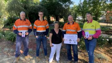 Liddell Coal Operations employees donate $12,000 to local charities including Singleton Cancer Appeal. Pictured is Kay Sullivan and representatives from the mine.