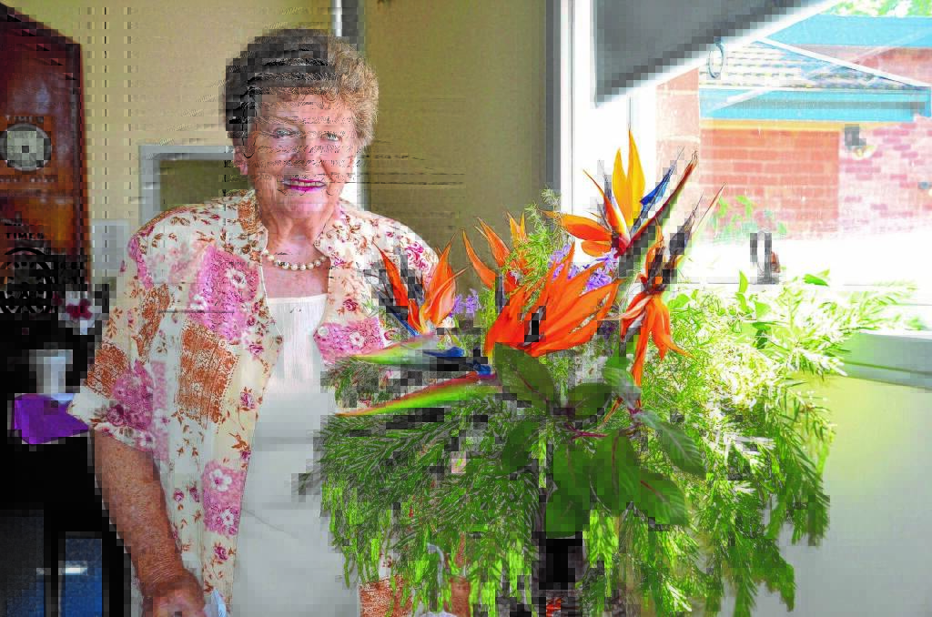 FLORAL DESIGN: Betty Iron with a floral display she helped put together for the 2015 Festival of the Flowers. The 2017 event will be held on October 7 and 8.
