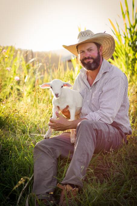 SUSTAINABLE FUTURE: From Dubbo to the coast meat sheep producer Andrew Yeo, Yeo Farm Bulahdelah, with an Australian White lamb. Photos Em Yeo. 